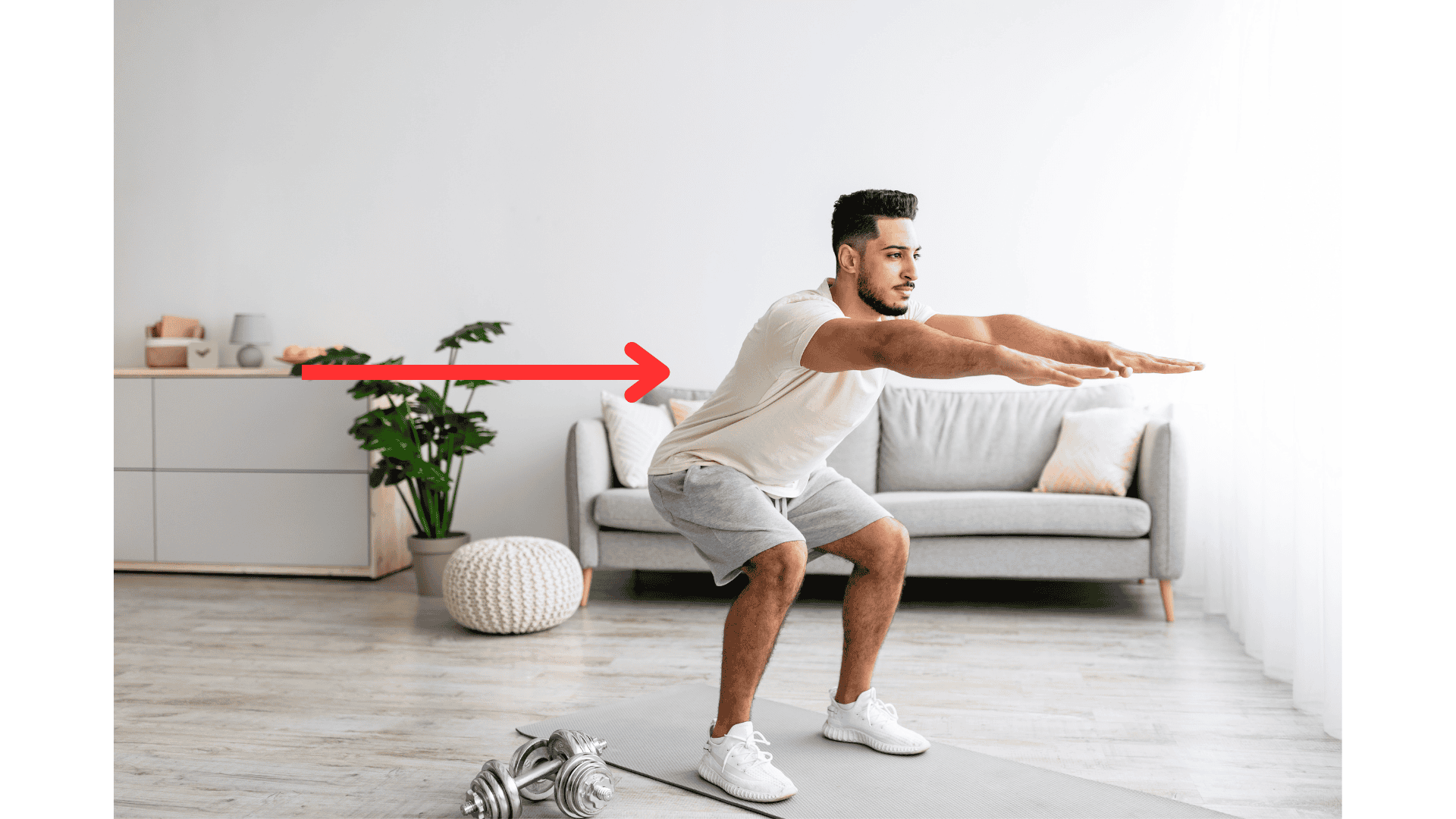 man performing a bodyweight squat