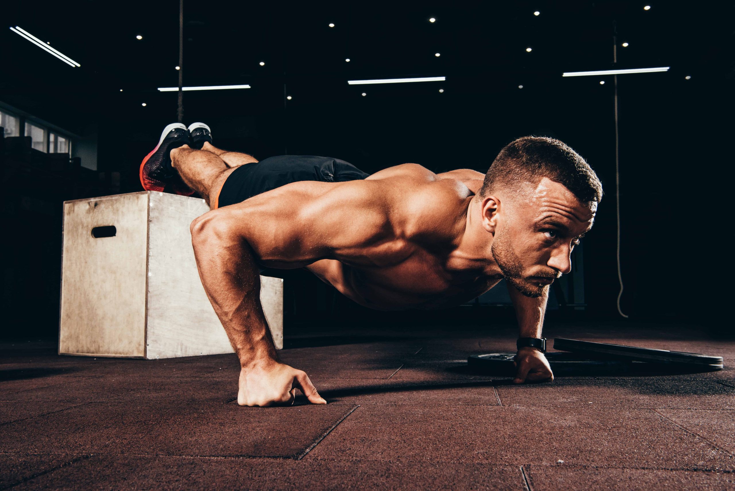 man performing decline push up bodyweight chest exercises